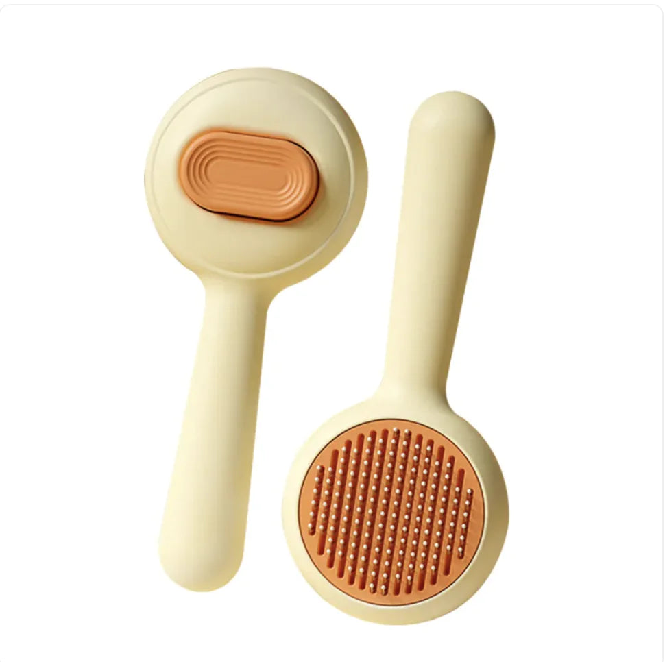 Grooming Brush — dual-function pet brush with non-slip grip