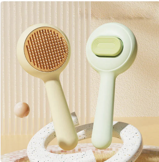 Grooming Brush — dual-function pet brush with non-slip grip
